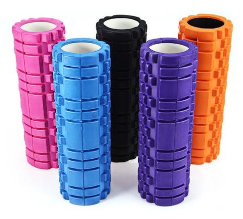 Textured yoga foam rollers in various colors including pink, blue, black, purple, and orange for muscle recovery.