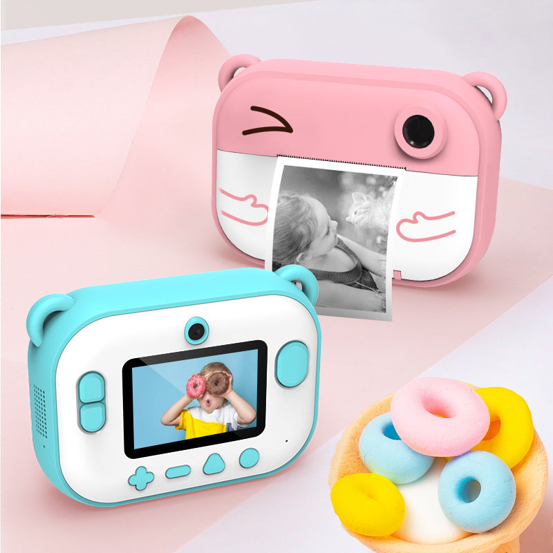 Cartoon instant-print children's camera — close-up detail view